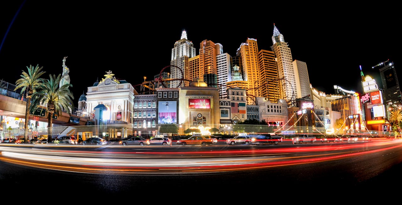 Illuminated cityscape of the Las Vegas Strip featuring iconic architecture and dazzling lights at night.