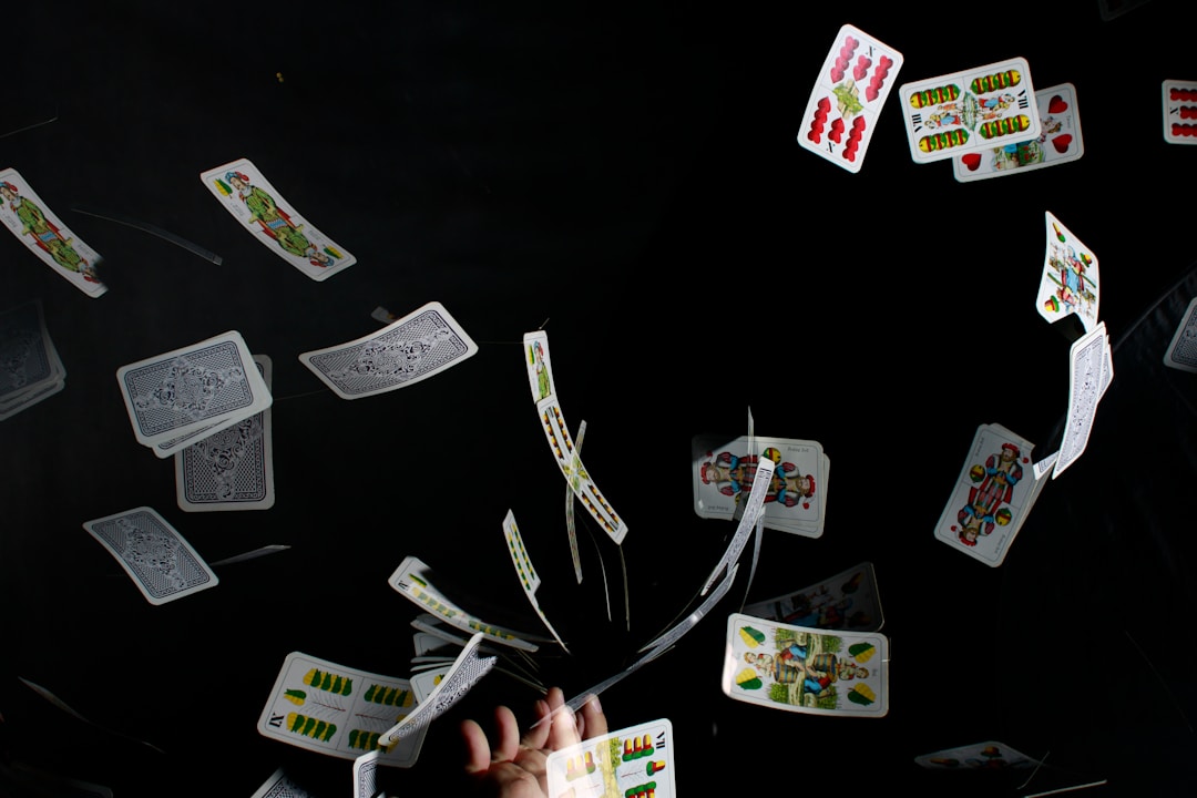 playing cards on black textile